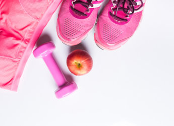 Women's sports bra,foot ware, Dumbbell and apple. Fitness wear and equipment. Sport fashion, Sport accessories, Sport equipment. for healthy concept.